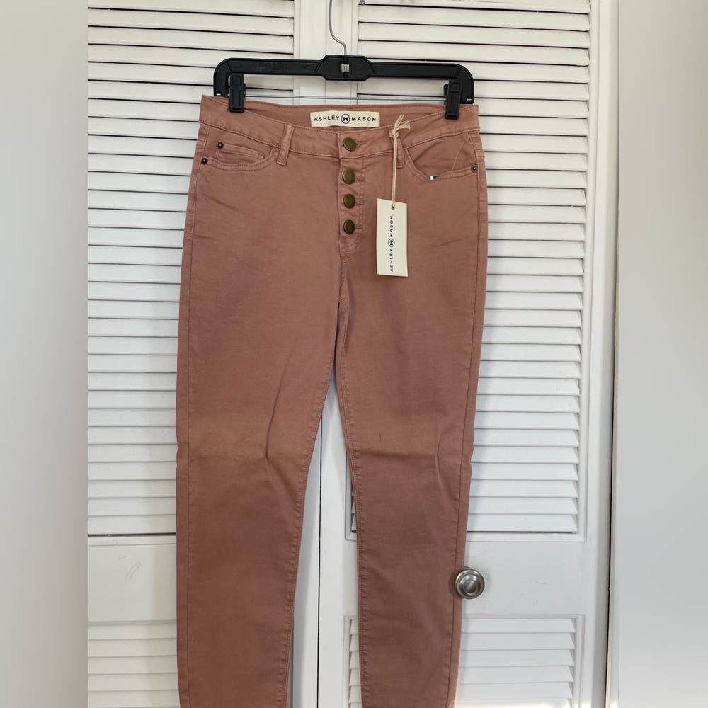 Pale pink skinny jeans